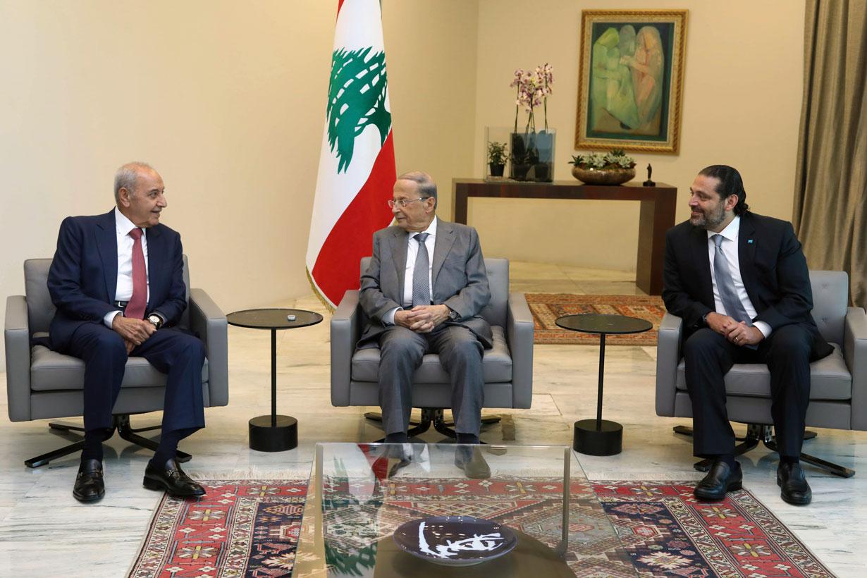 Lebanese President Michel Aoun, center, meets with Prime Minister Saad Hariri, right, and Parliament Speaker Nabih Berri, left