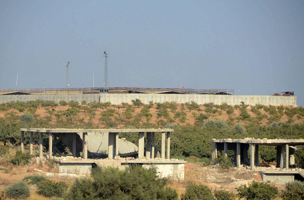 A Turkish observation post (background) is pictured in the town of Morek in northwest Syria