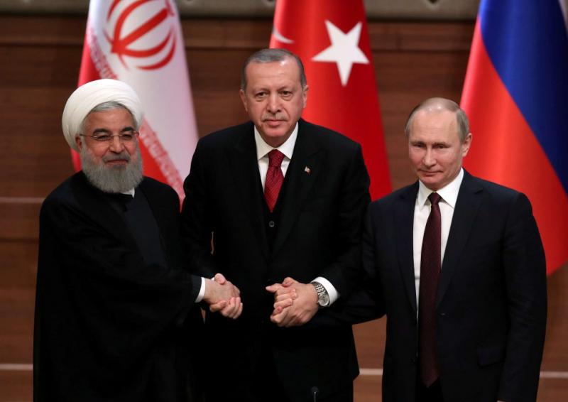 Iranian President Hassan Rohani (L), Turkish President Recep Tayyip Erdogan and Russian President Vladimir Putin