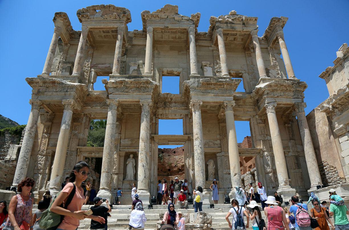Tourists visit the Celsius Library in the ancient city of Ephesus near Izmir, Turkey