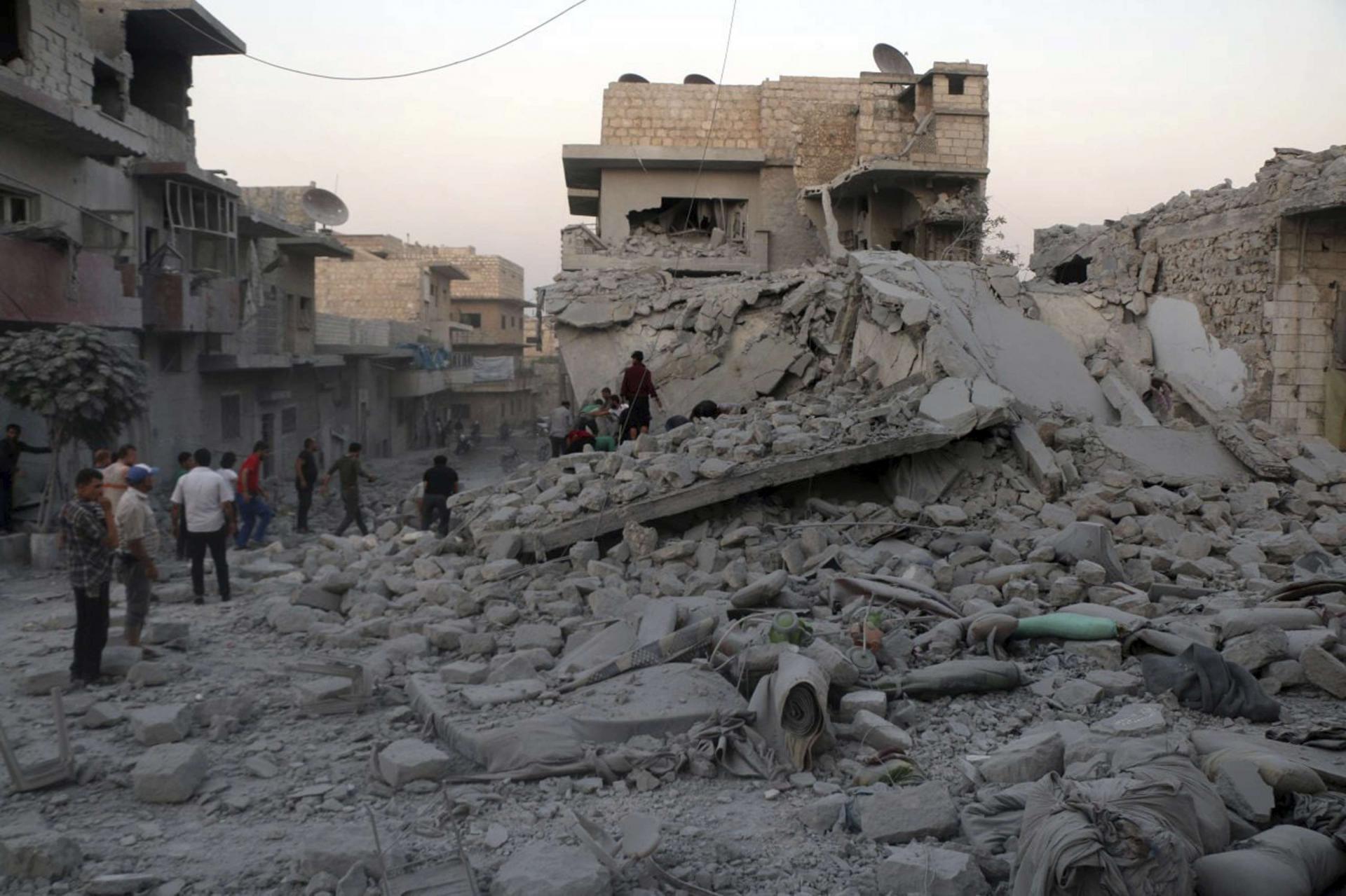 Syrian people searching for victims under the rubble of destroyed buildings