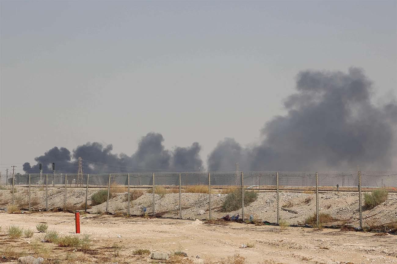 Smoke billows from an Aramco oil facility in Abqaiq 