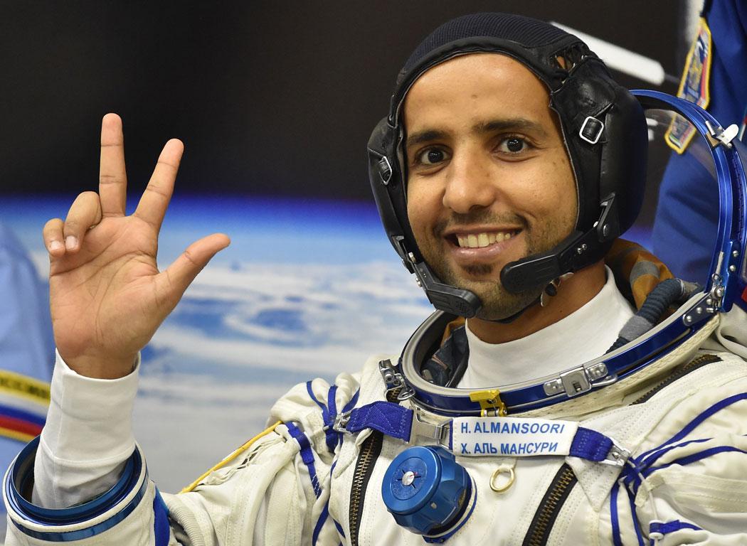 United Arab Emirates' astronaut Hazza Al Mansouri waves before boarding a Soyuz rocket to the International Space Station (ISS) at the Russian-leased Baikonur cosmodrome in Kazakhstan