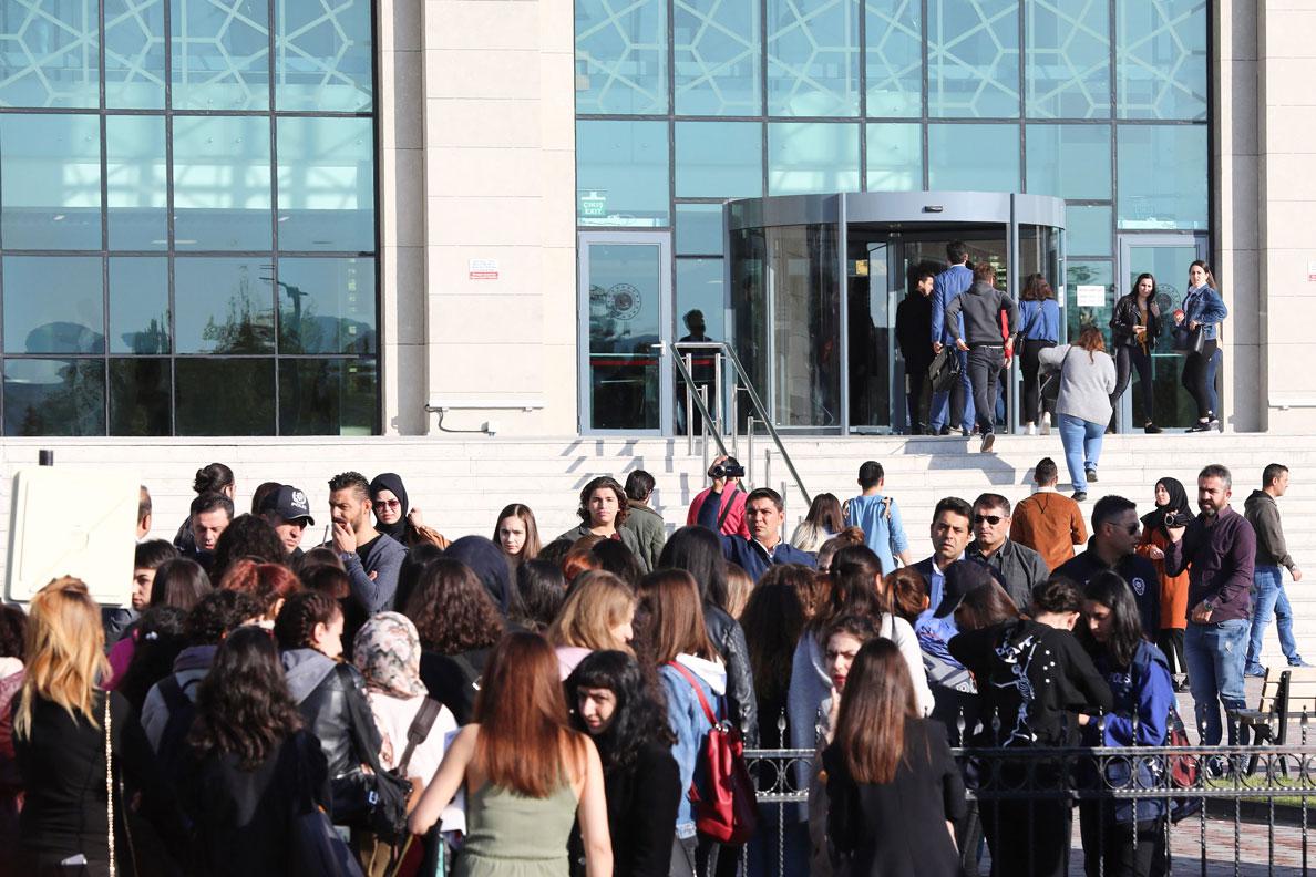 People gather for the first hearing over the killing of Emine Bulut in Kirikkale Courthouse