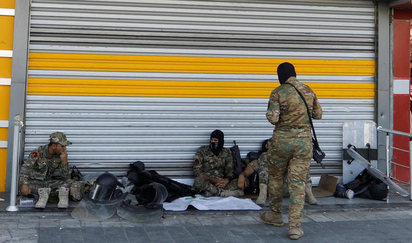 Iraqi security forces pictured in Tahrir square after the lifting of the curfew