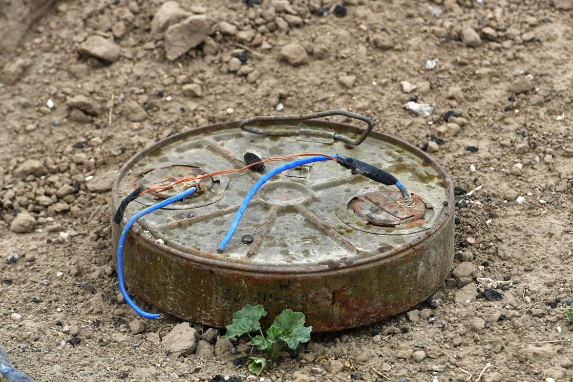 Discarded landmine lying on the ground in the village of Baghouz in Syria's eastern Deir Ezzor province