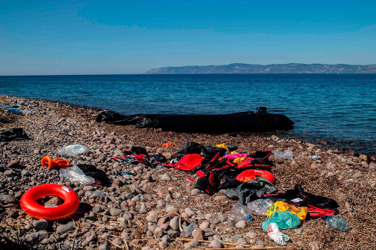 Life jackets used by refugees lie on a beach in Skala Sykamias on the island of Lesbos