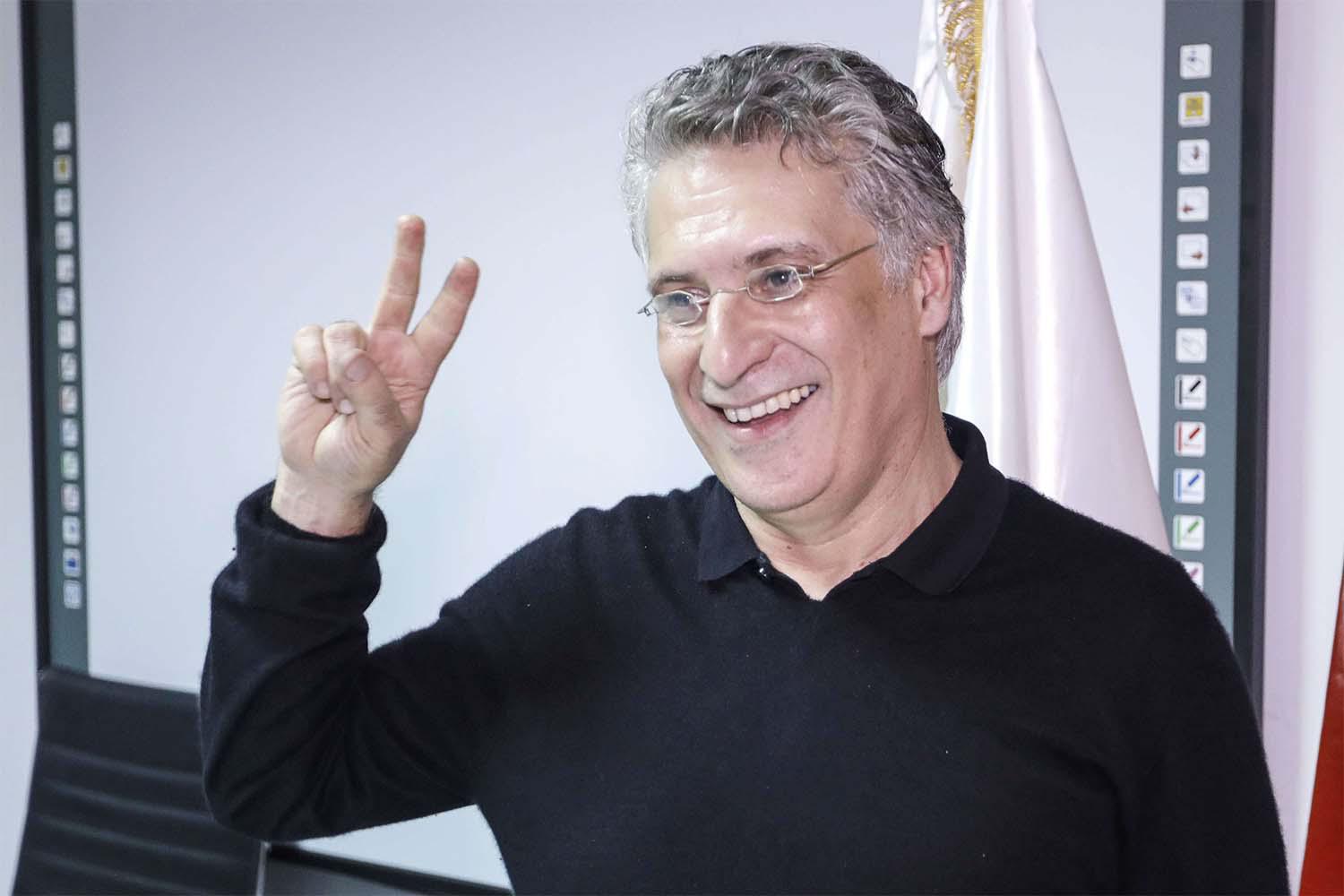 unisian presidential candidate and media magnate Nabil Karoui poses for a picture at his campaign headquarters after his release