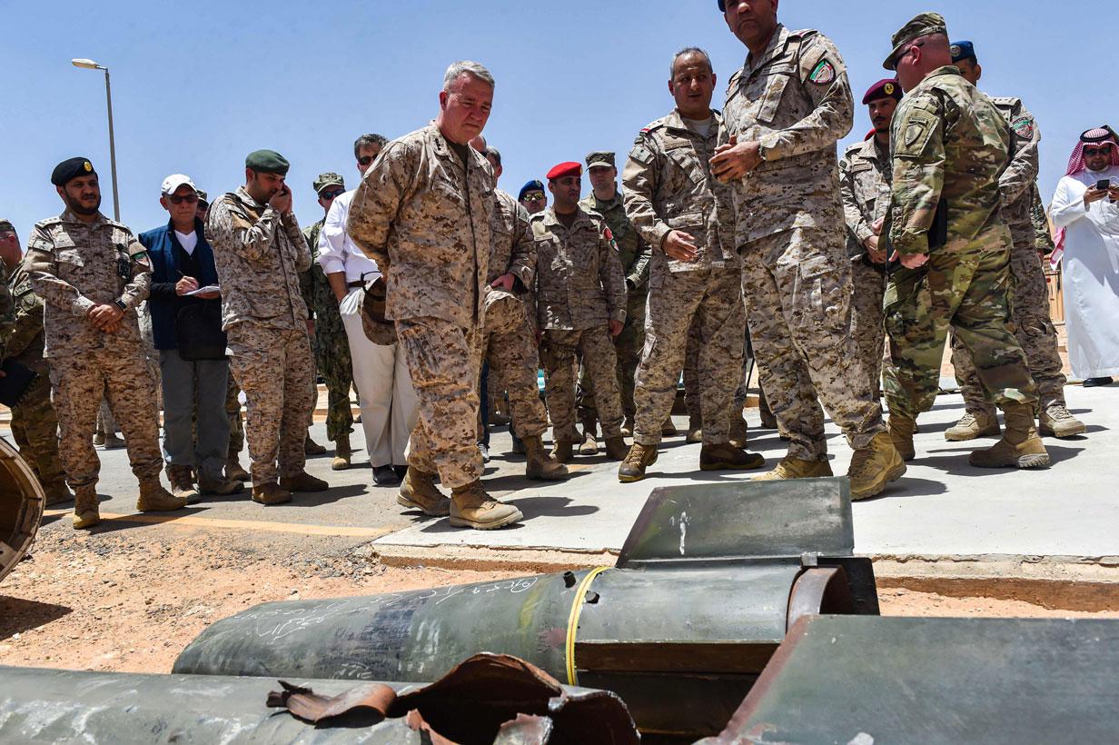 US Marine Corps General Kenneth F. McKenzie Jr. (7th-L), commander of the US Central Command (CENTCOM), is shown alleged Iranian weapons seized by Saudi forces from Yemen's Huthi rebels