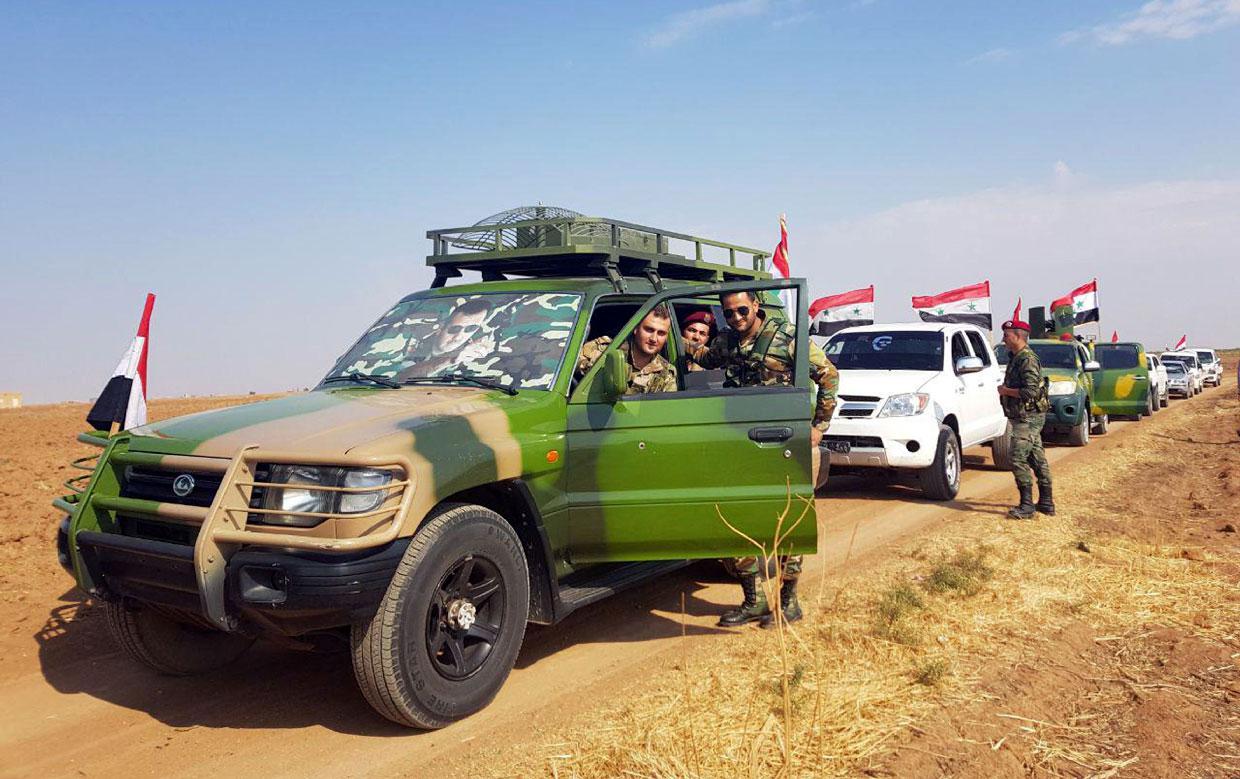 A convoy of the Syrian army on a road between the northeastern cities of Tal Tamer and Ras al-Ain