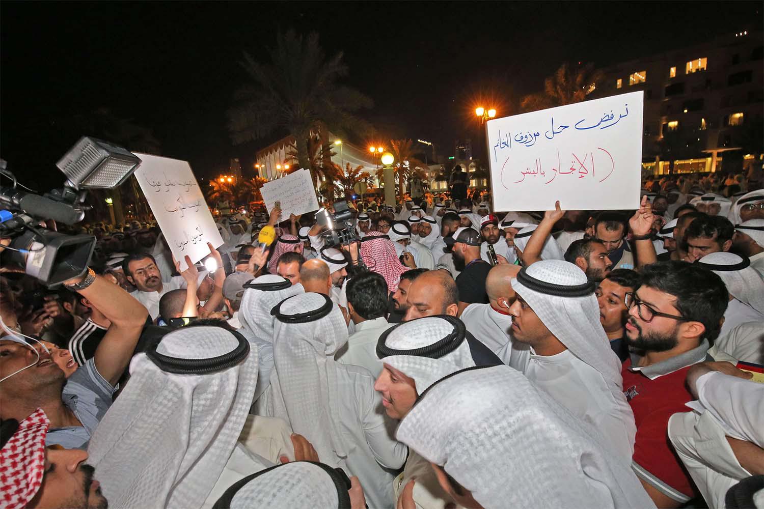 Protesters called on speaker of parliament Marzouq al-Ghanim to step down