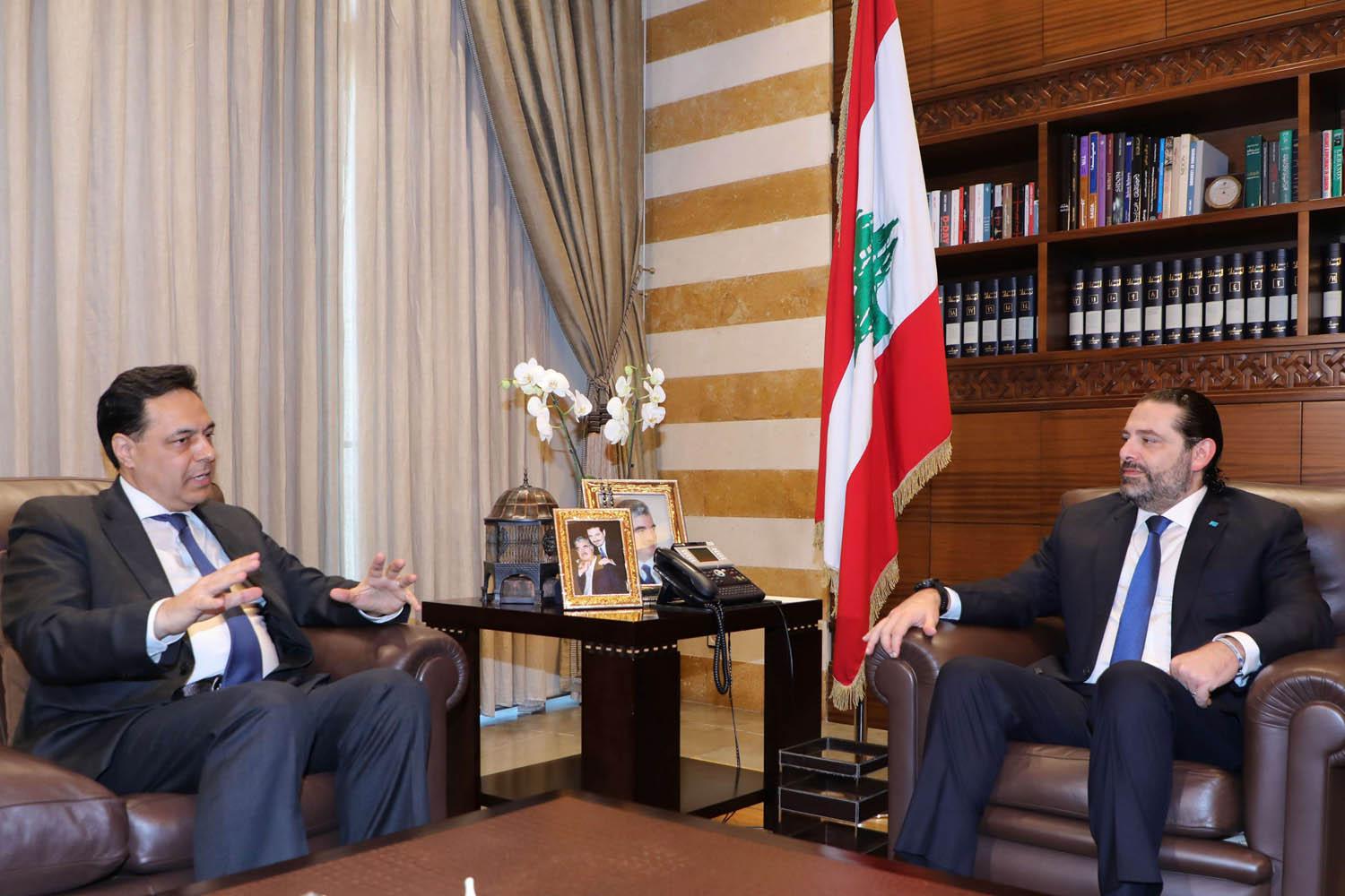 رئيس الوزراء اللبناني المستقيل سعد الحريري يستقبل رئيس الوزراء المكلف حسان دياب