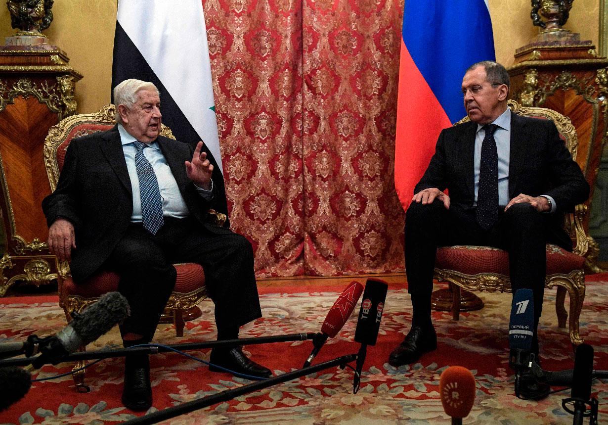 Russian Foreign Minister Sergey Lavrov (R) and his Syrian counterpart Walid Muallem