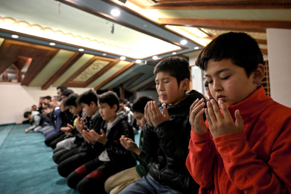 Uighur students pray after lessons on November 29, 2019 at Silivri district in Istanbul