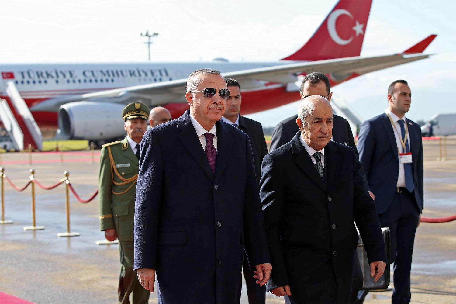 lgerian President Abdelmadjid Tebboune (R) welcoming Turkish President Recep Tayyip Erdogan in Algiers