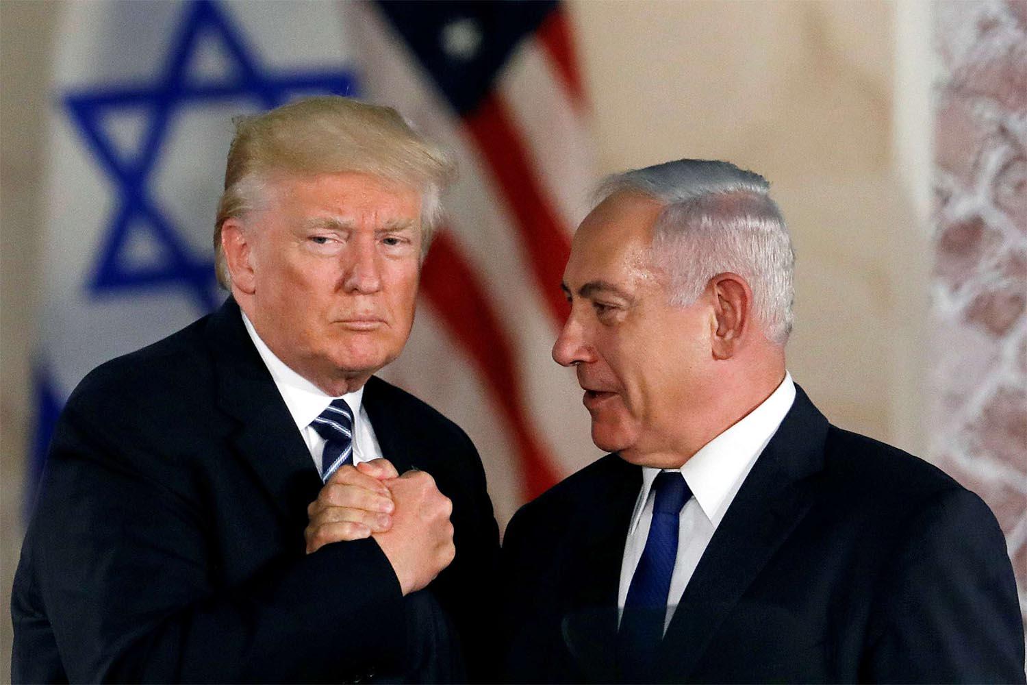 US President Donald Trump and Israeli Prime Minister Benjamin Netanyahu shake hands 