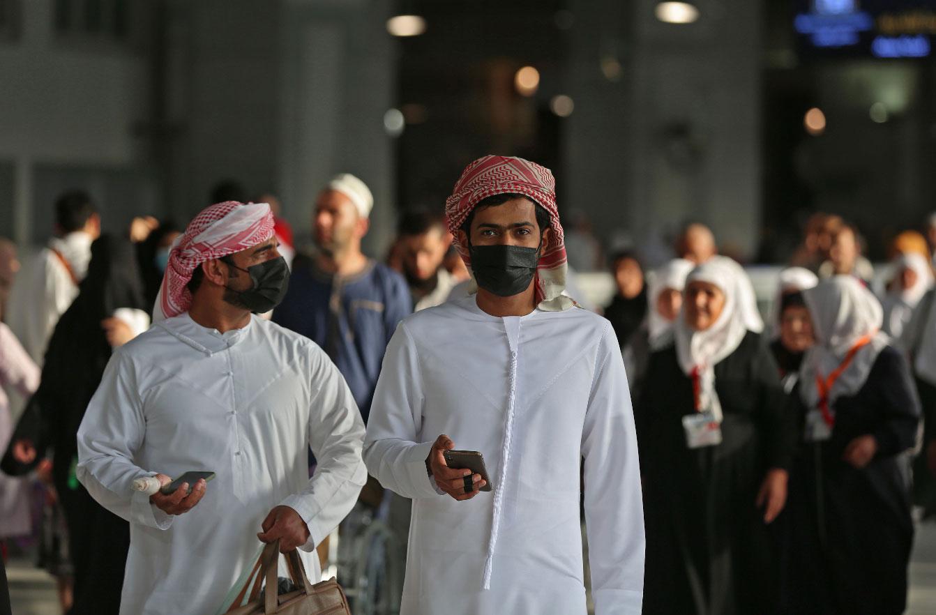 Muslim pilgrims wear masks at the Grand Mosque in Saudi Arabia's holy city of Mecca