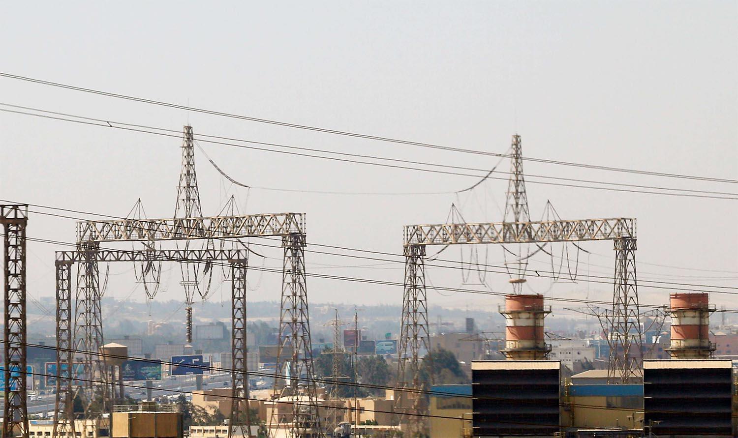 Electricity pylons and power transmission lines are seen in Cairo