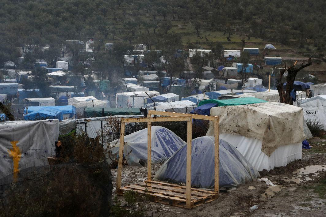 A view of temporary camp for refugees and migrants next to the Moria camp during heavy rainfall on the island of Lesbos