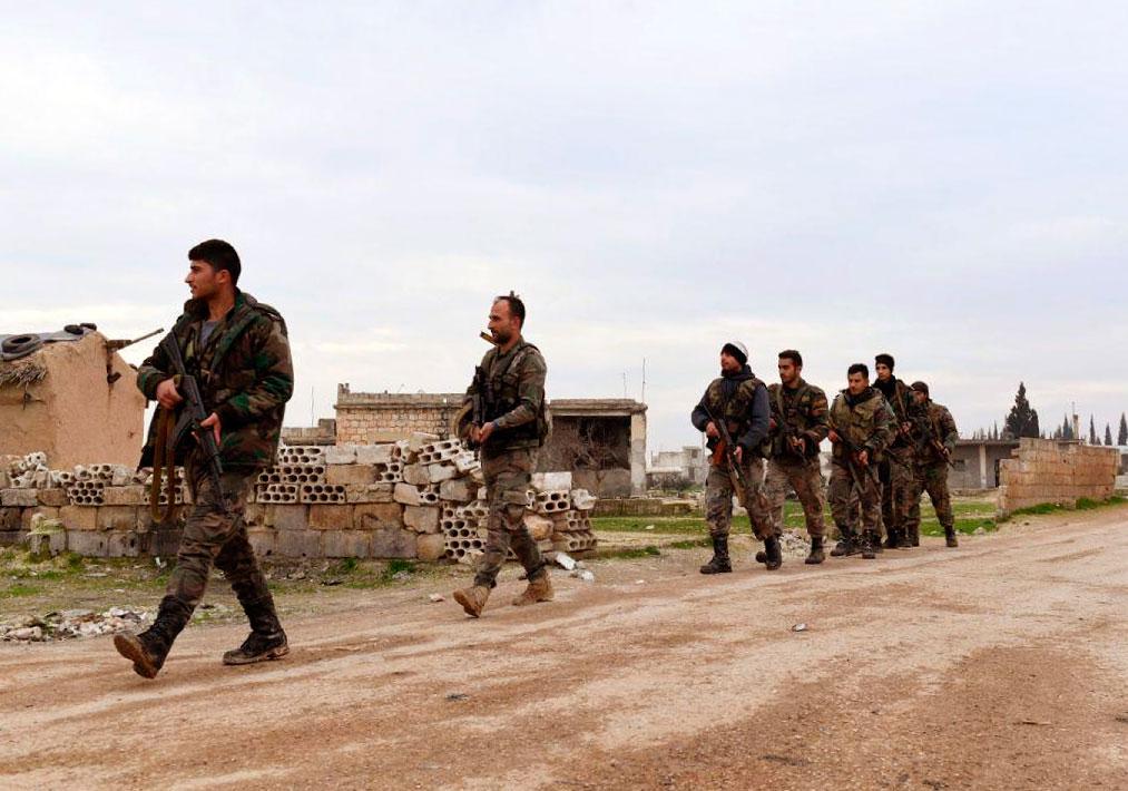Syrian government forces patrolling the village of Tel-Toukan, in Idlib province