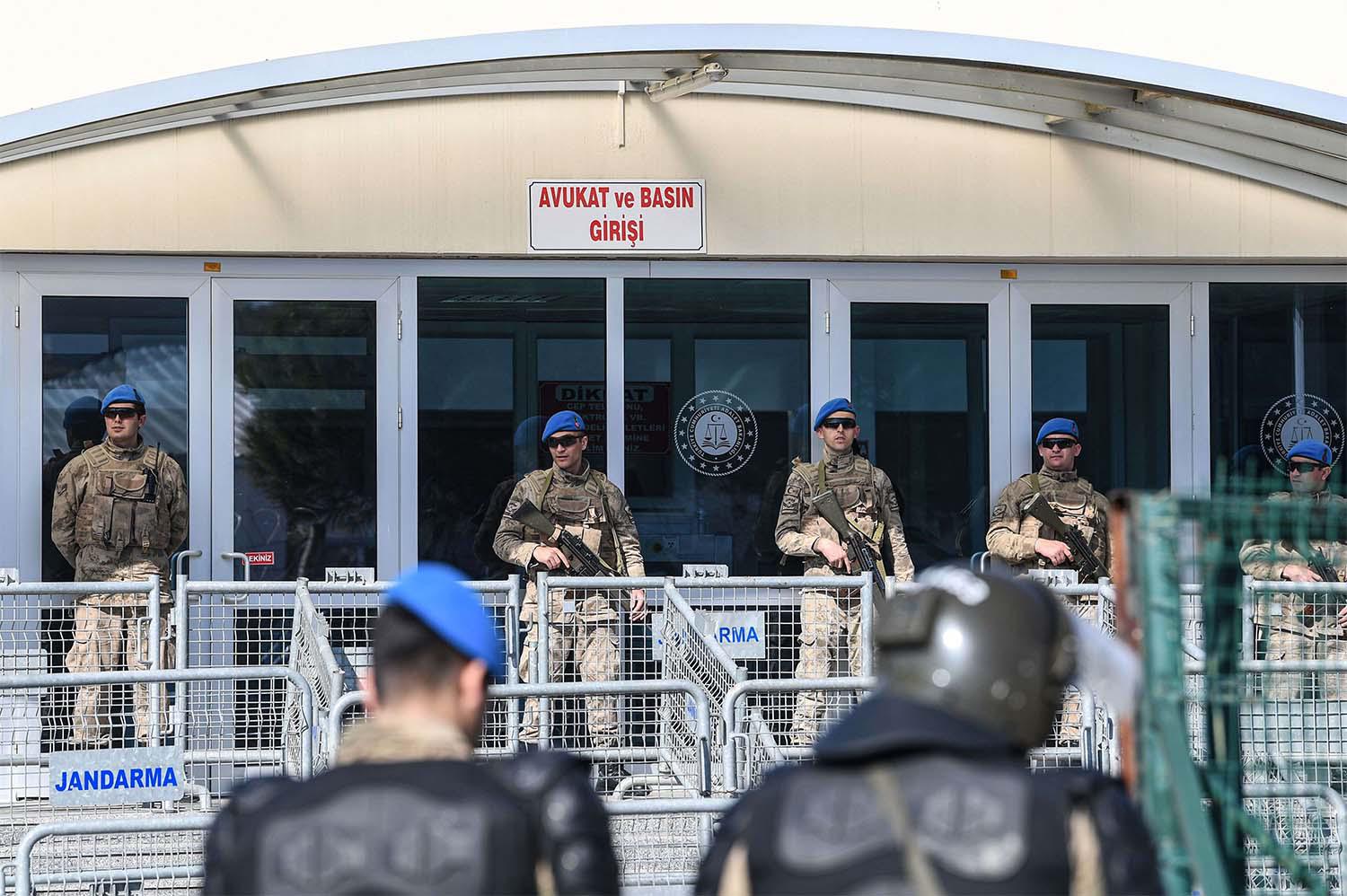 A member of the media waits in front of the Silivri Prison and Courthouse complex in Silivri, near Istanbul