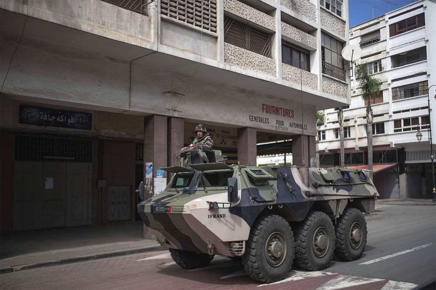 A military vehicle patrols the streets to enforce a health state of emergency and home confinement orders, in Rabat