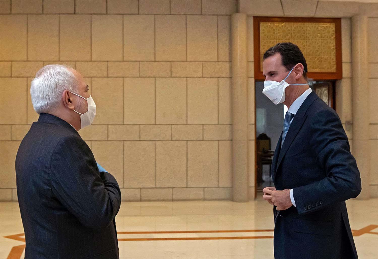 Syrian President Bashar Al-Assad (R) meeting Iranian PM Mohammad Javad Zarif