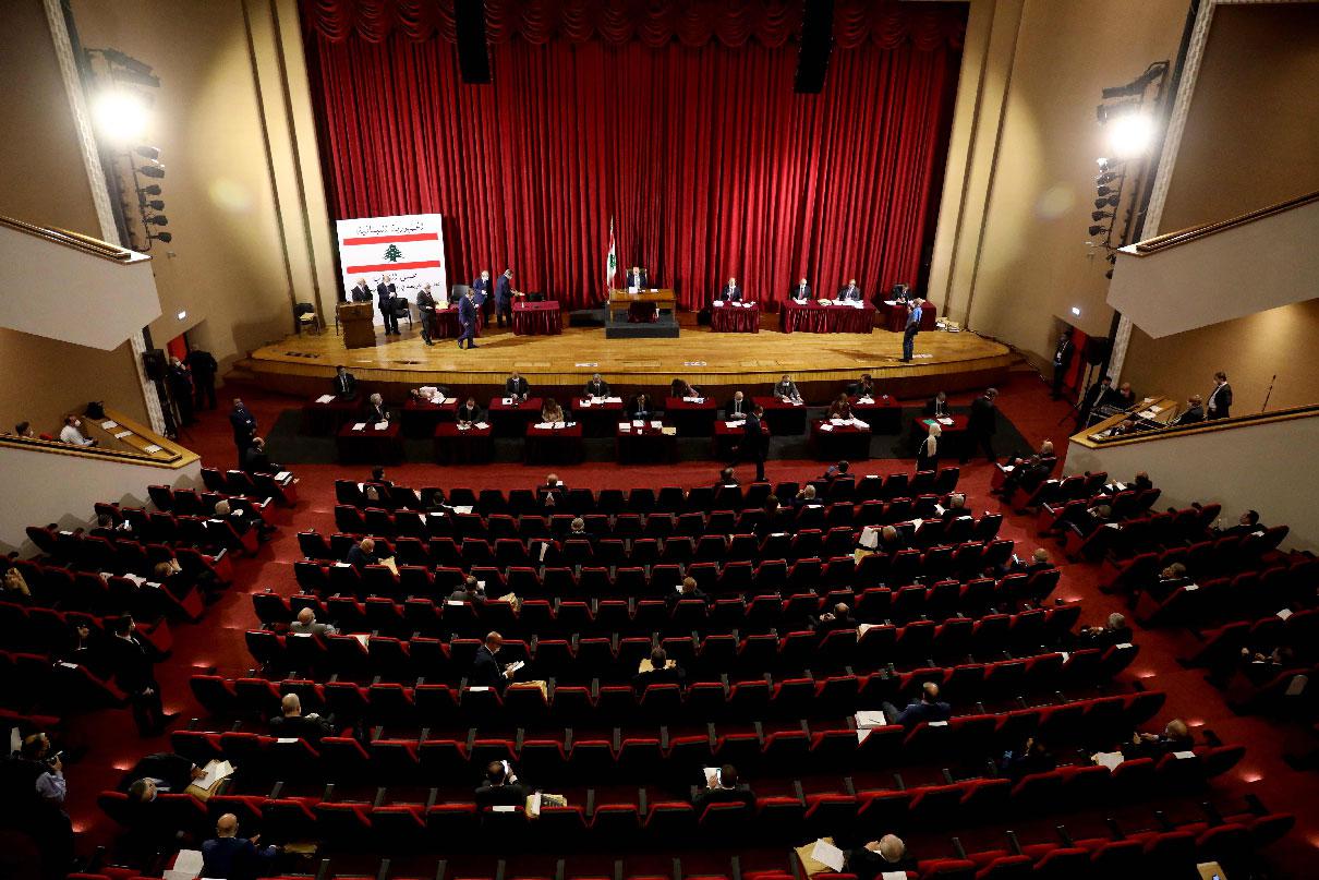 Lebanese members of Parliament attend a legislative session in a theatre hall