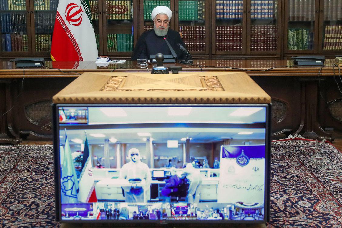 Iranian President Hassan Rouhani attends a video conference