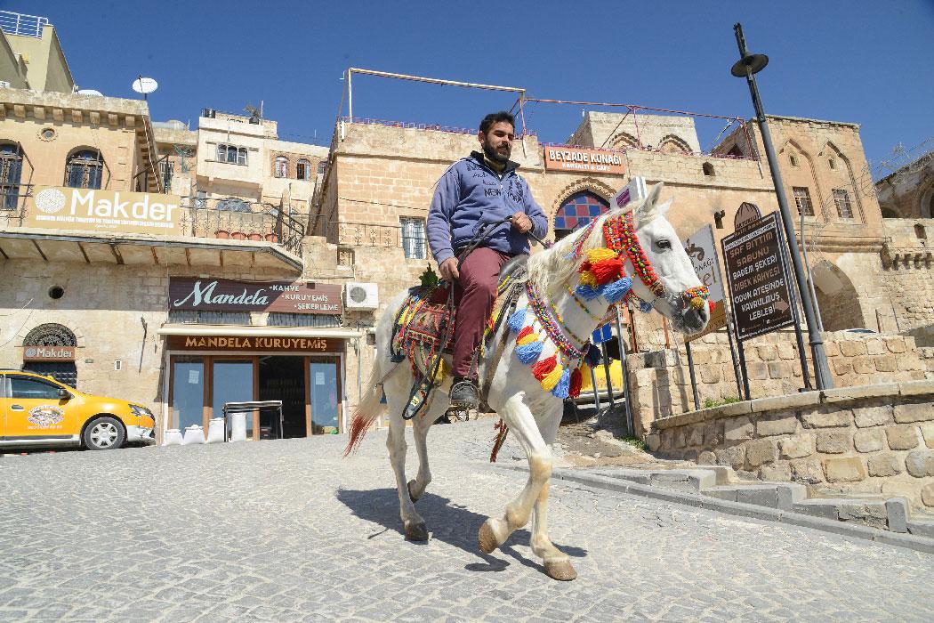 A man rides a horse in the south-eastern Turkish city of Mardin
