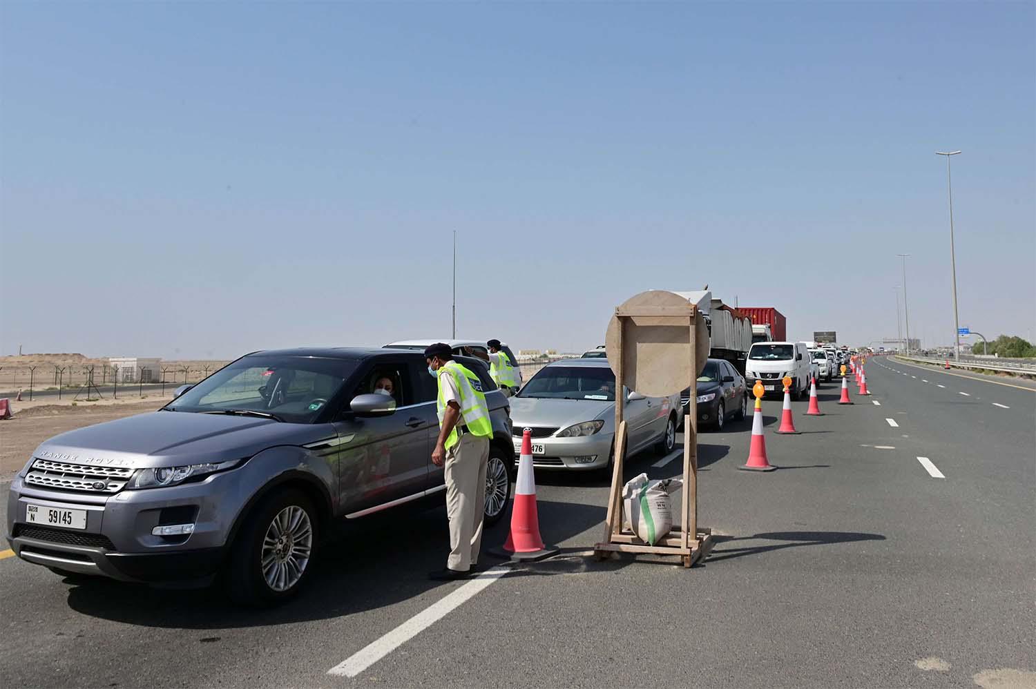 Emirati security forces man a checkpoint at the entrance of Abu Dhabi