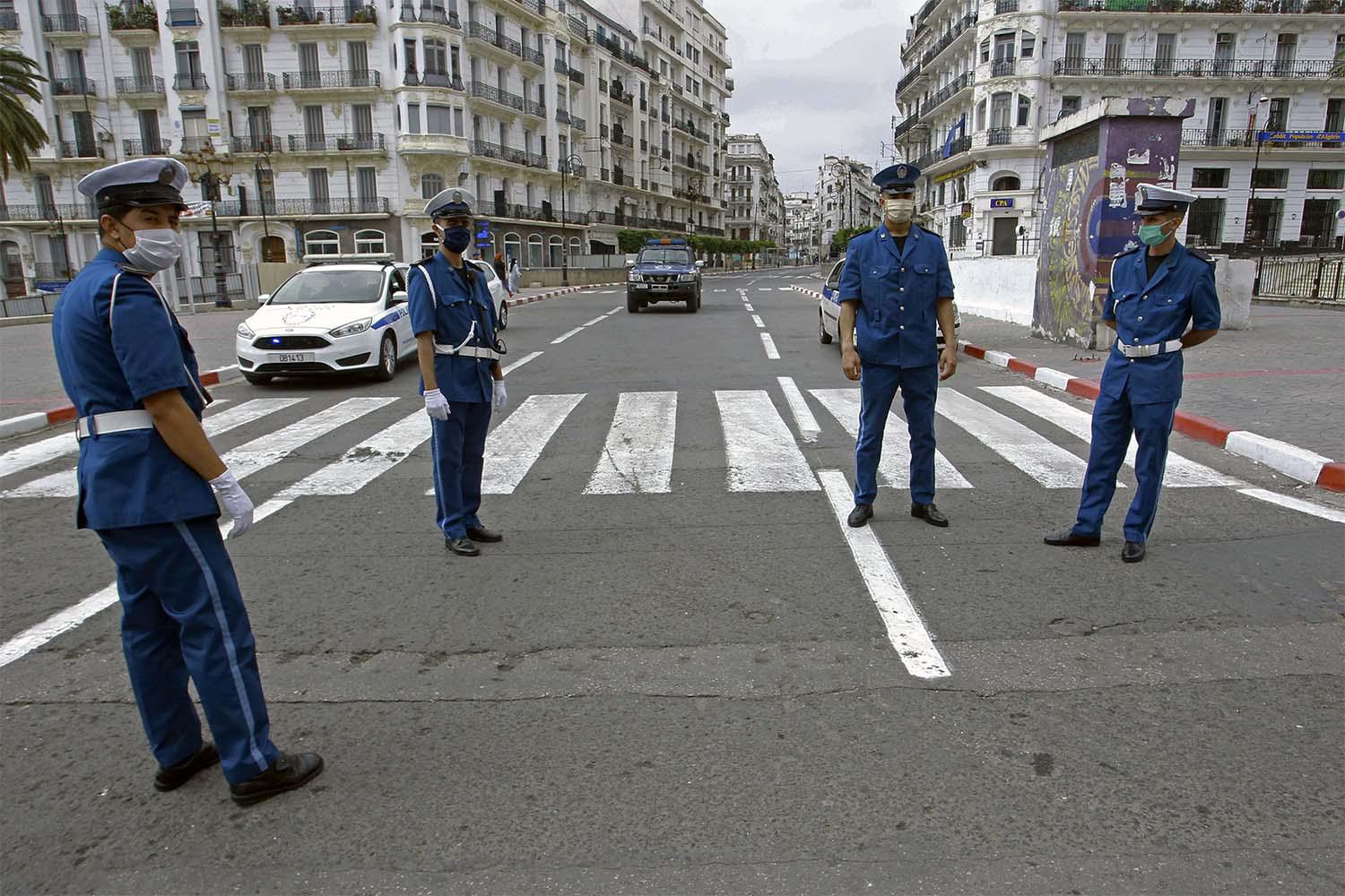 Algerian police officers block the access in downtown Algiers