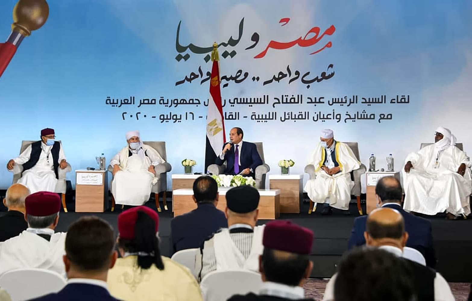 President Abdel Fattah al-Sisi (C) meeting with the mask-clad Libyan tribal leaders
