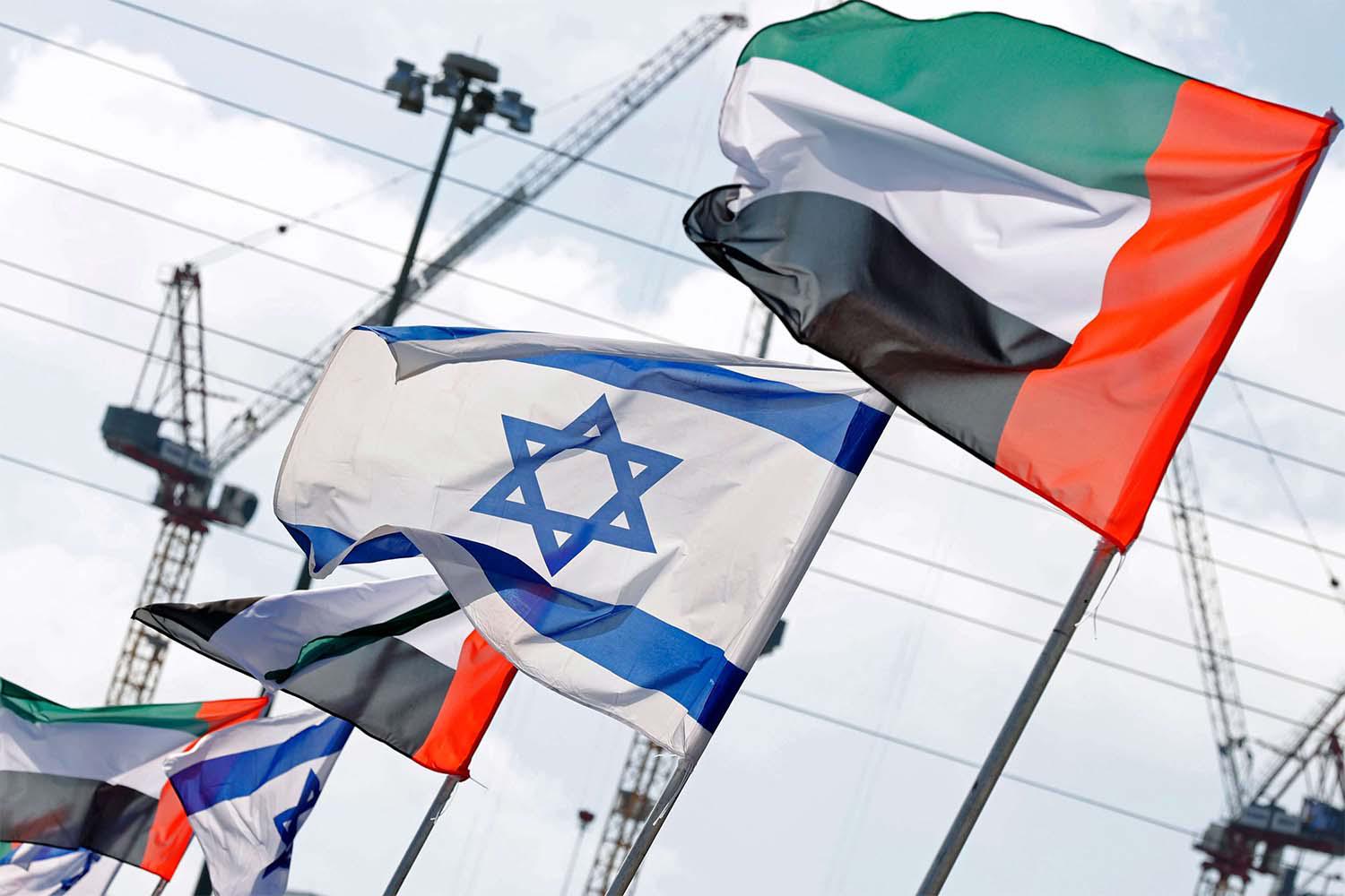 Israeli and UAE flags line a road in the Israeli coastal city of Netanya