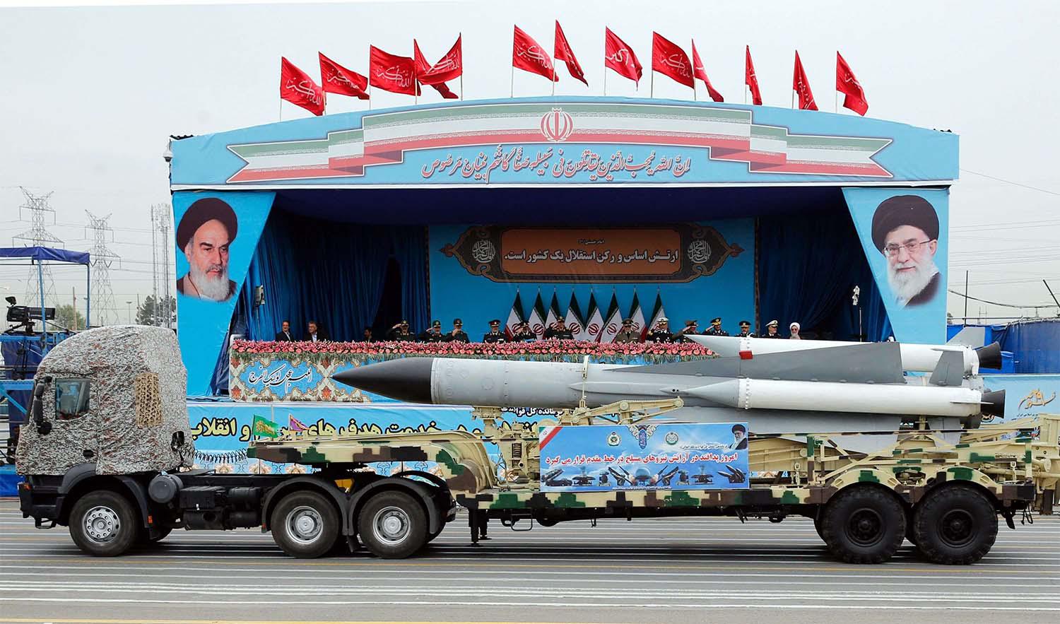 A Iranian military truck carrying a missile drives in front of the officials' stand during a military parade marking the annual National Army Day in Tehran last year