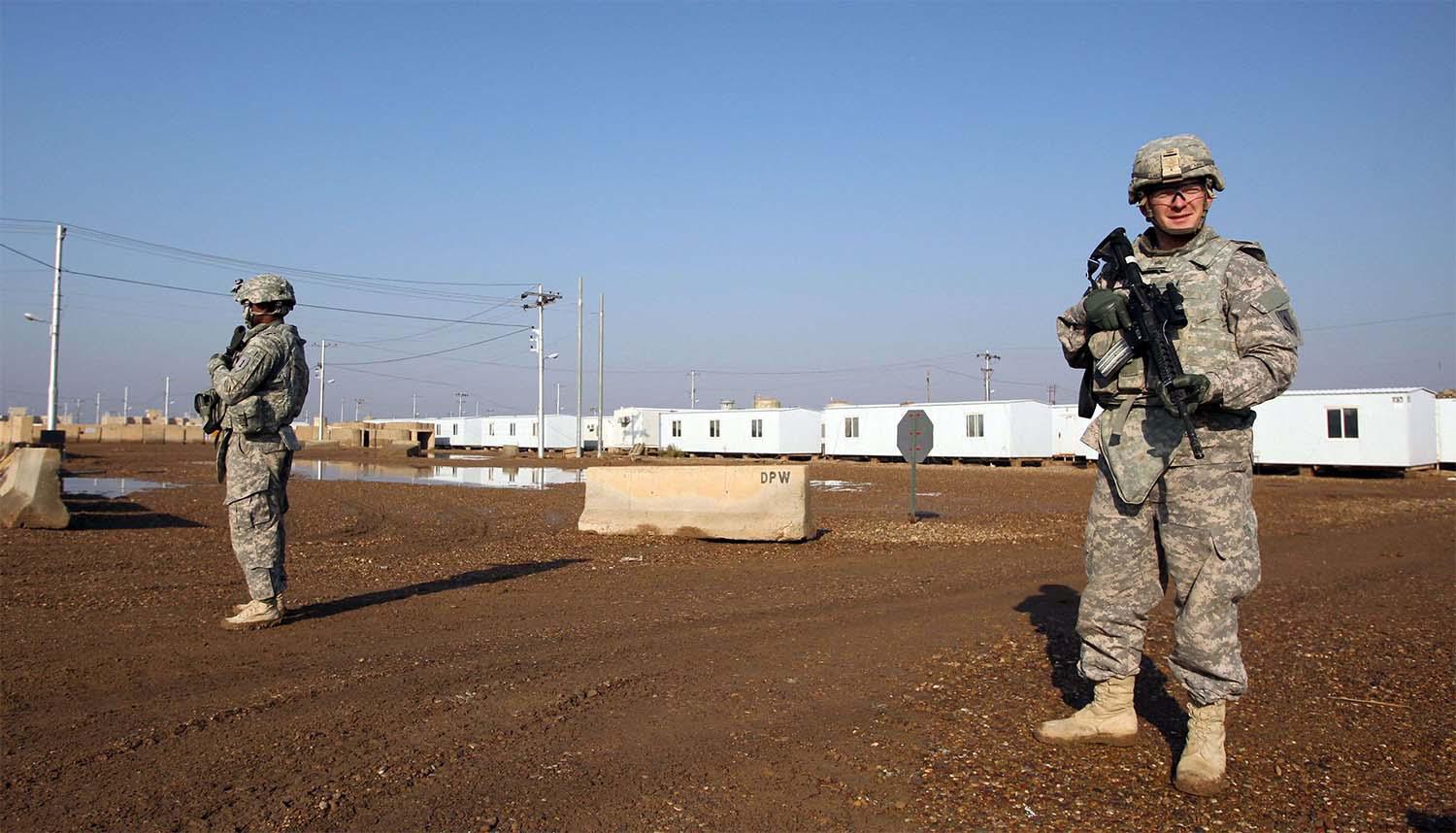 US soldiers walk around at the Taji base complex 