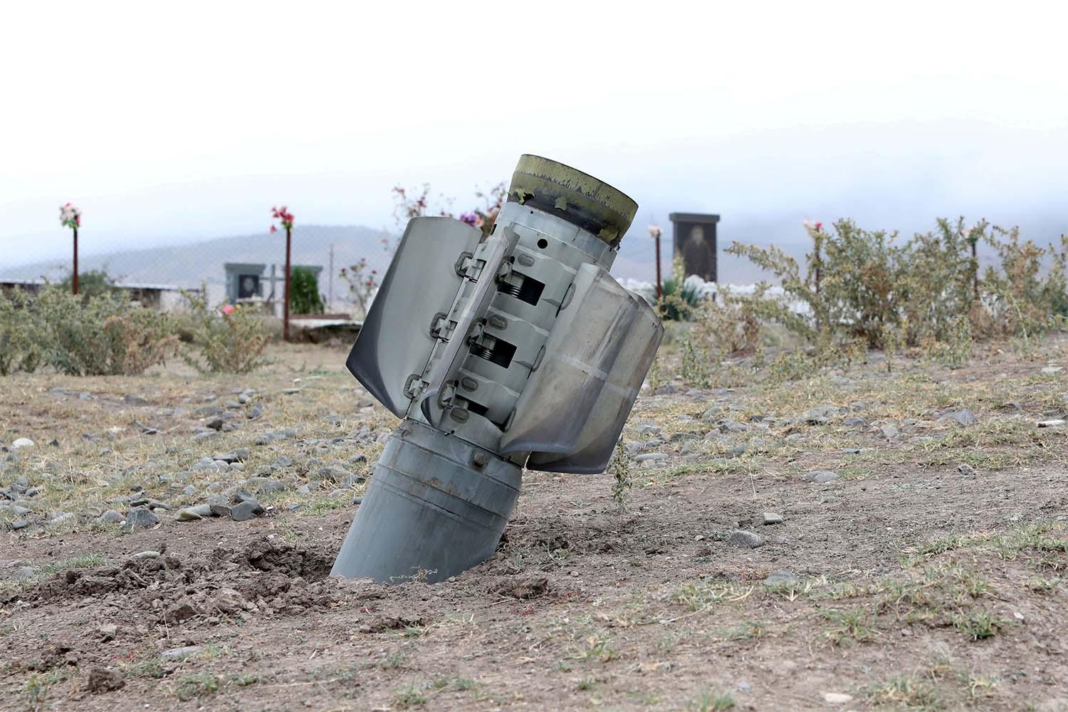 he remains of a rocket shell are seen near a graveyard in the town of Ivanyan (Khojaly) in the breakaway region of Nagorno-Karabakh
