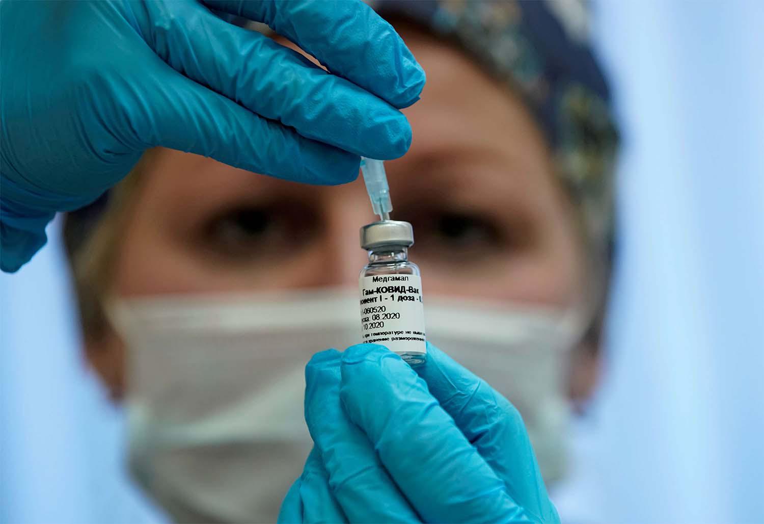 A nurse prepares Russia's "Sputnik-V" vaccine against the coronavirus disease