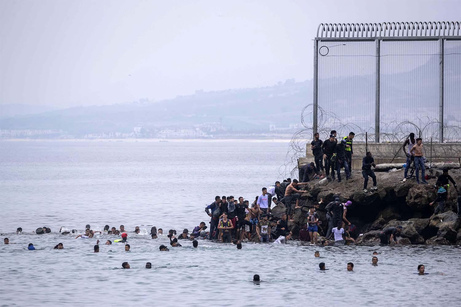 Around 8,000 migrants, many from Sub-Saharan Africa and including 1,500 minors, entered Ceuta