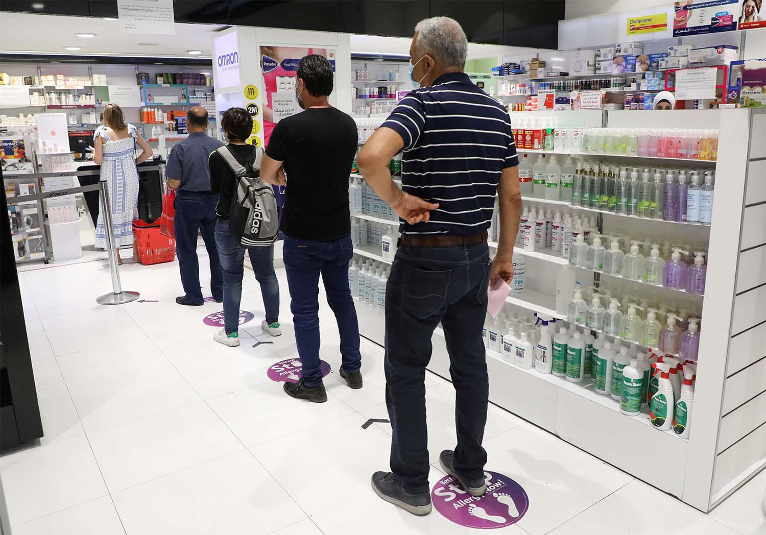 Lebanese queue up in a pharmacy