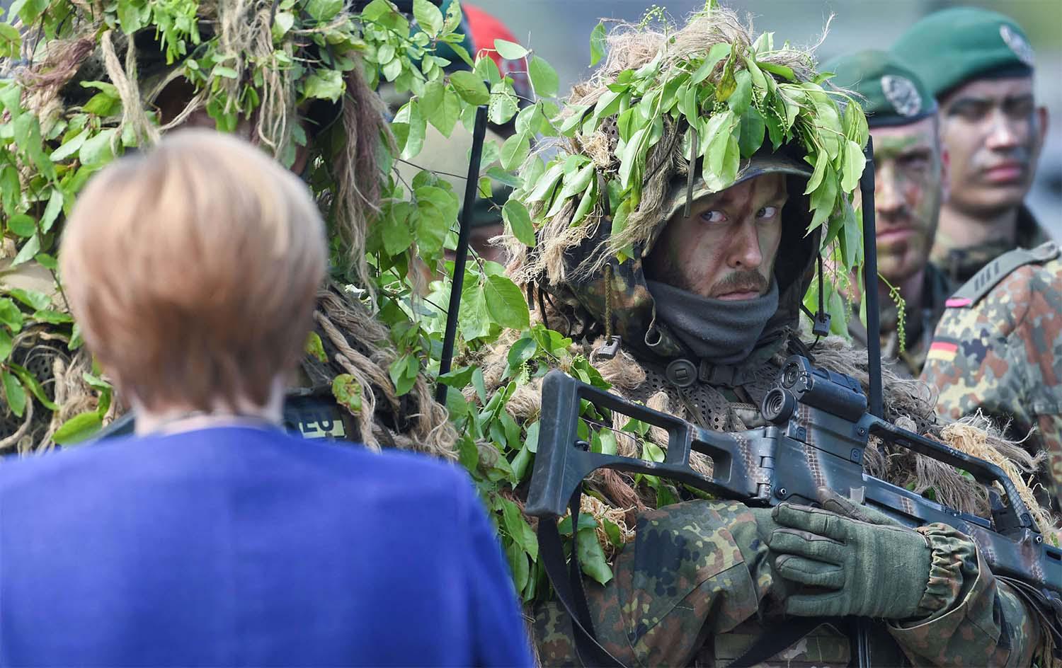 German chancellor Angela Merkel talking to soldiers of the German armed forces Bundeswehr 