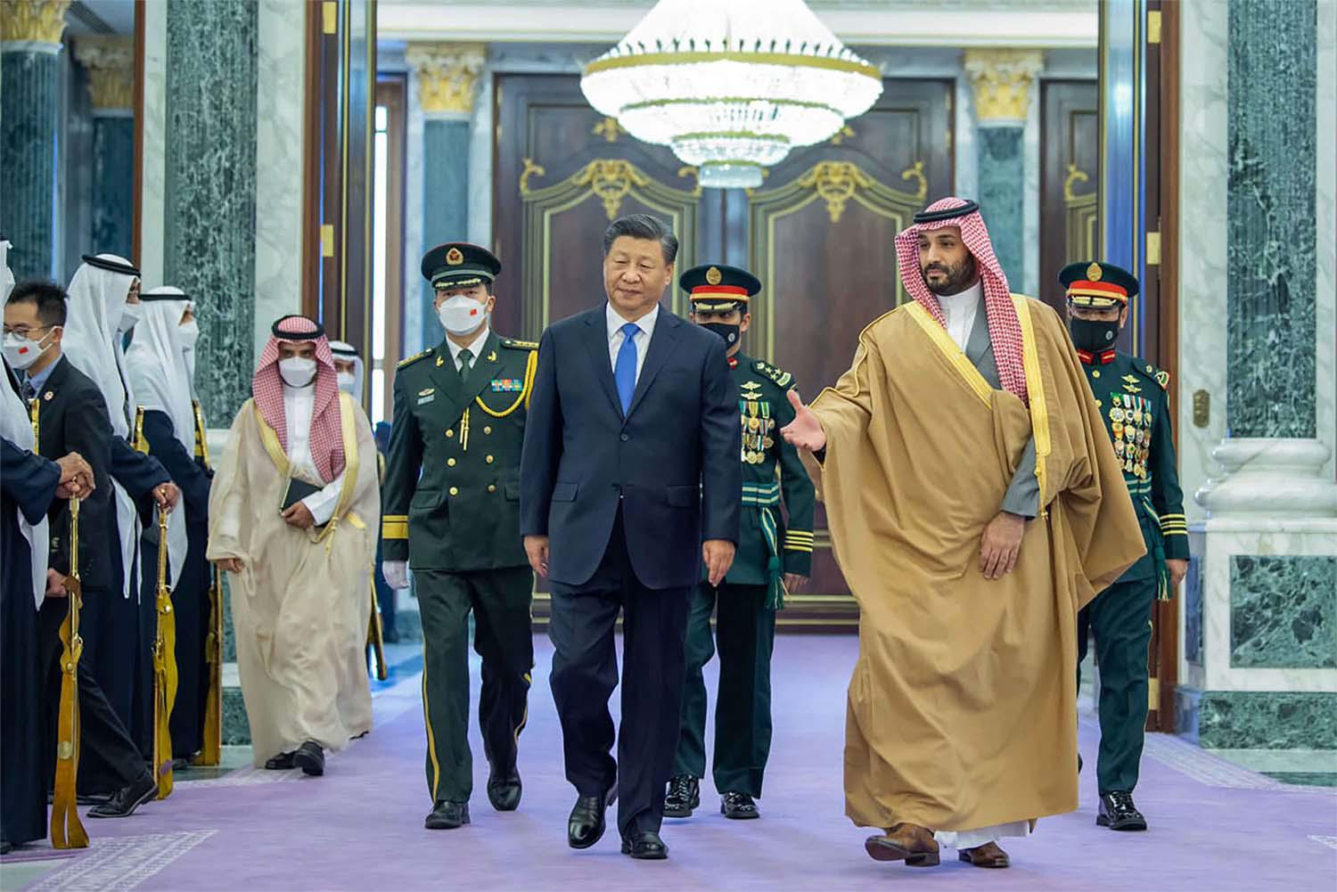 Chinese President Xi Jinping, left, is greeted by Saudi Crown Prince and Prime Minister Mohammed bin Salman