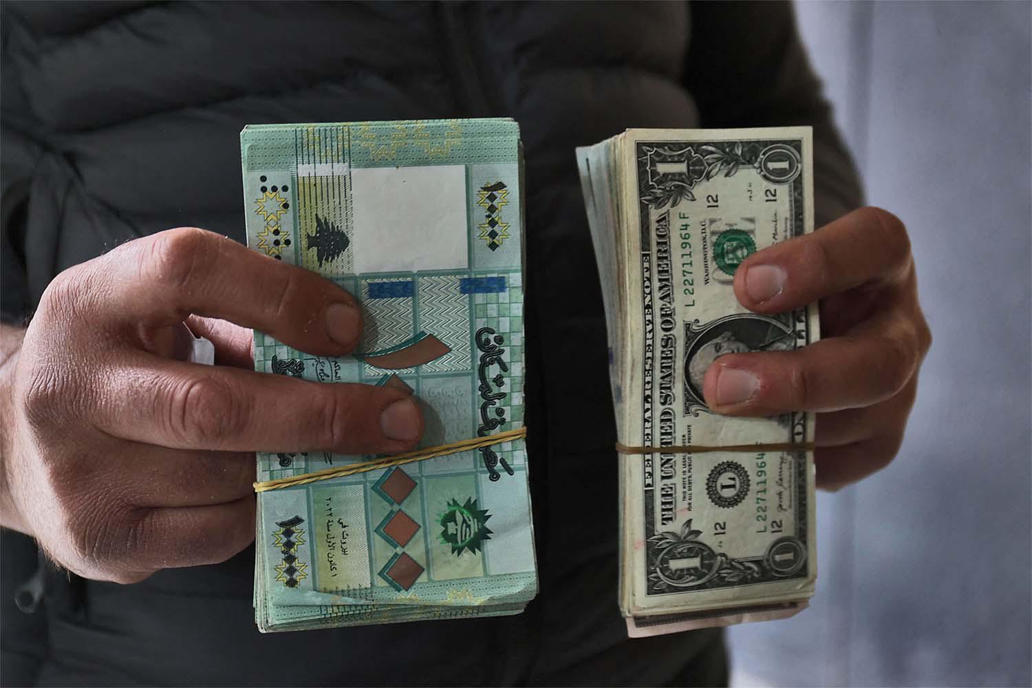 The new rate of 100,000 pounds to the dollar was posted on mobile apps Tuesday used by private money exchangers