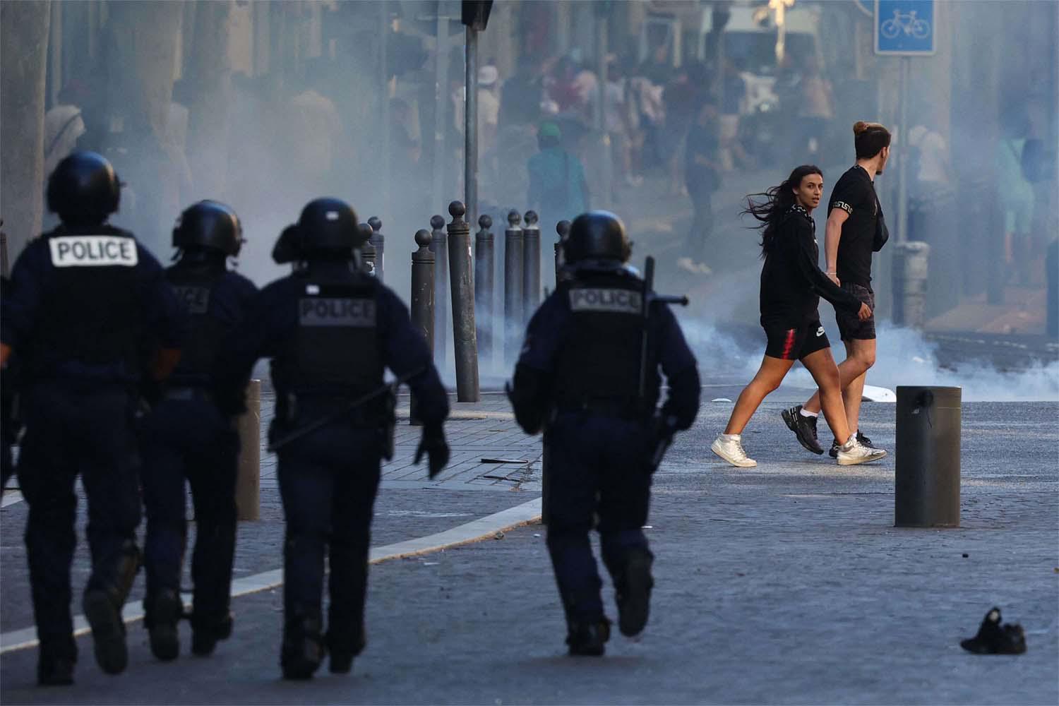 Three of the 45,000 police officers deployed overnight were injured