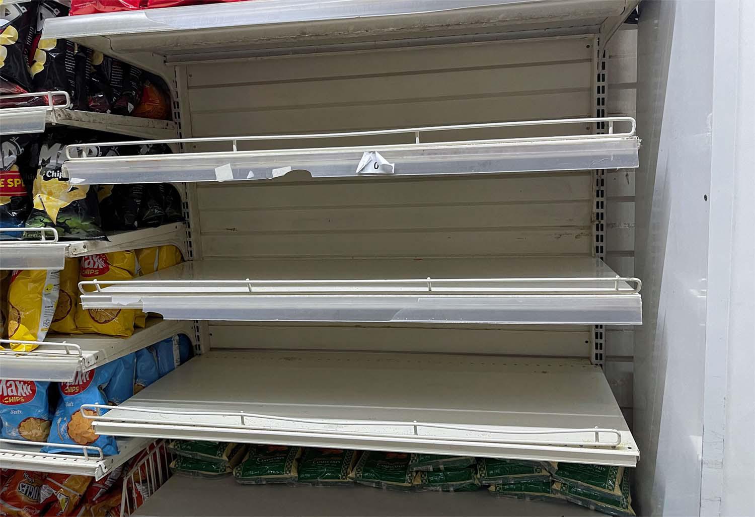 Empty shelves are seen in the rice section inside a supermarket in Tunis