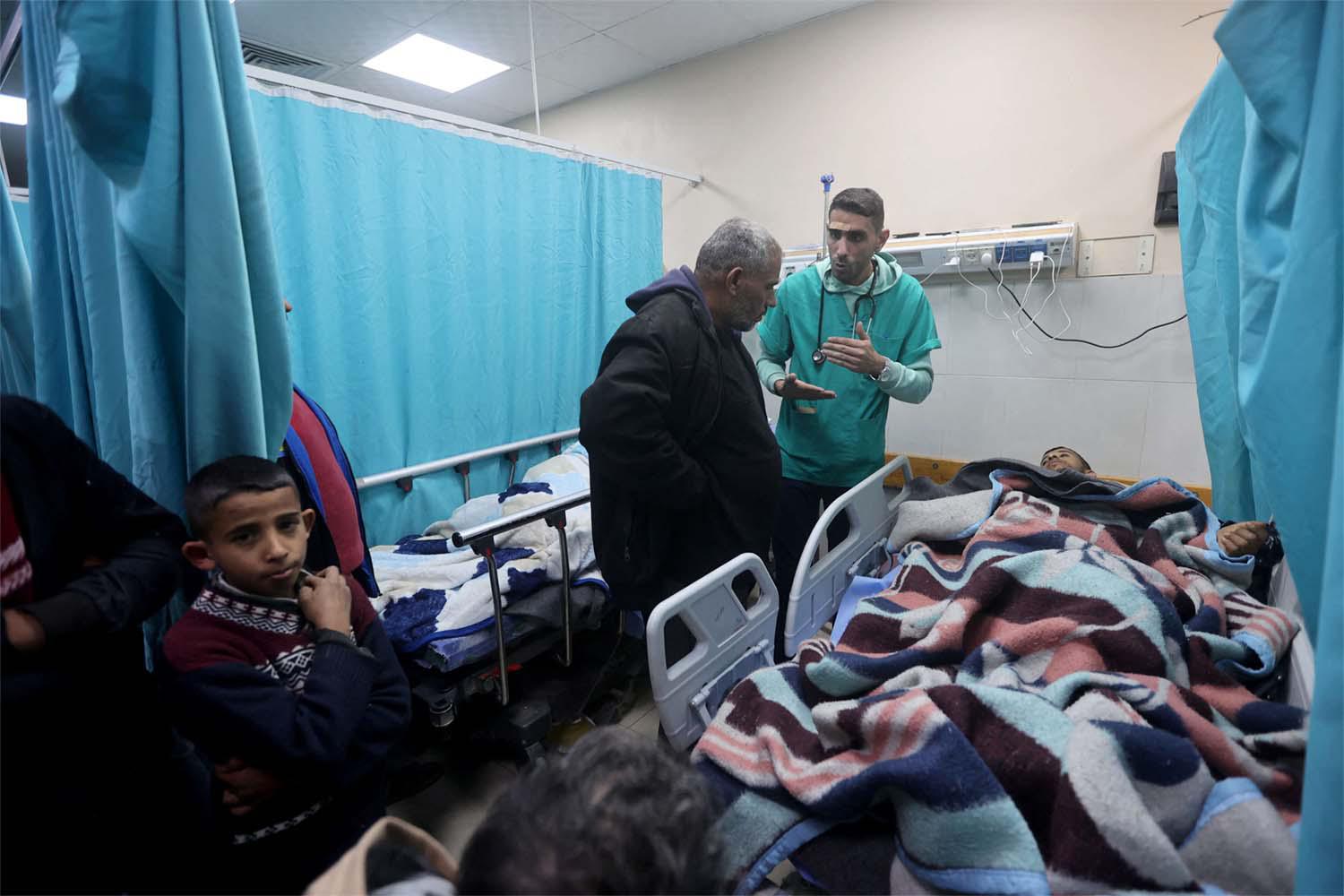 A Palestinian man wounded in an Israeli strike lies on a bed at Nasser hospital in Khan Younis  last month