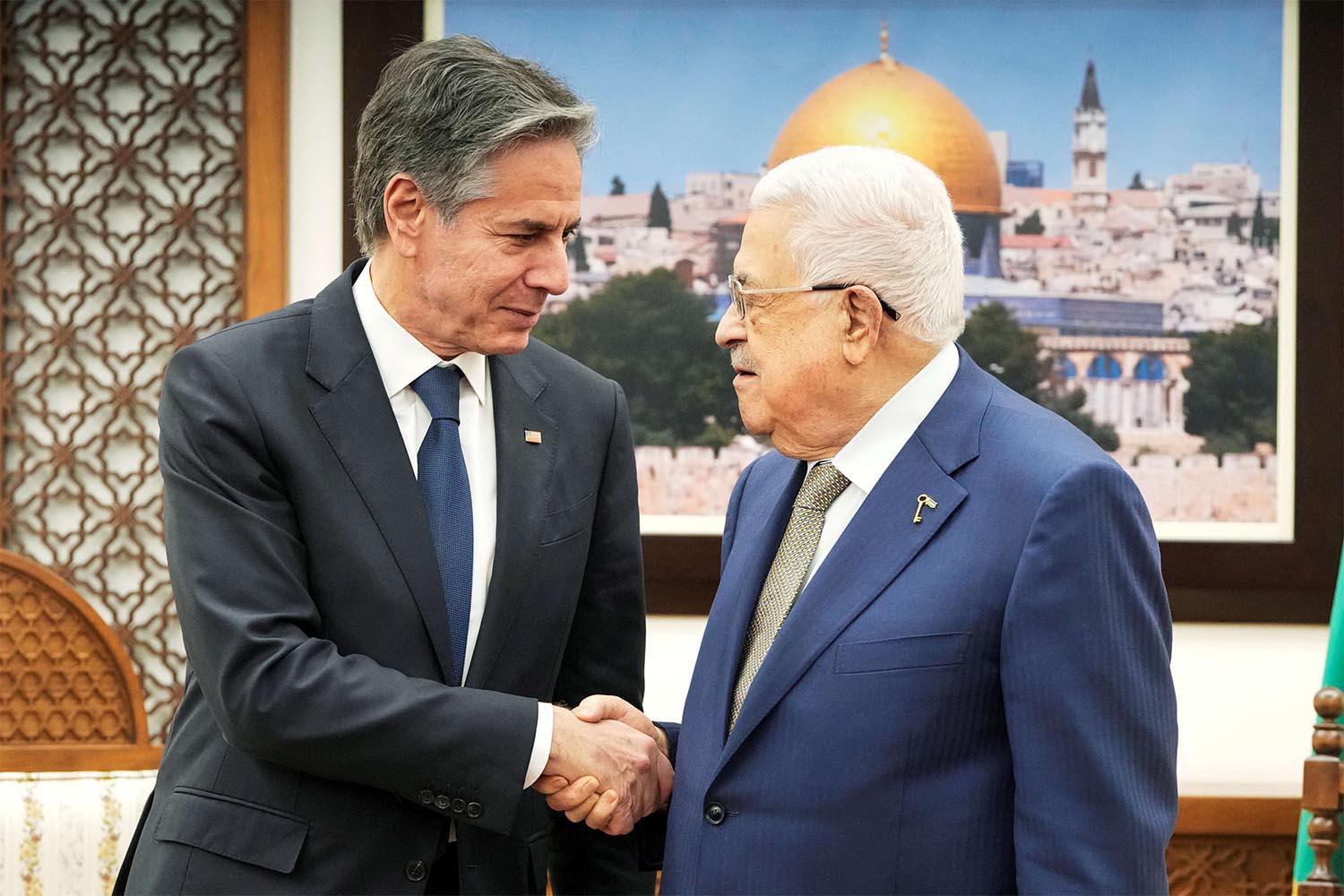 Abbas shaking hands with Blinken