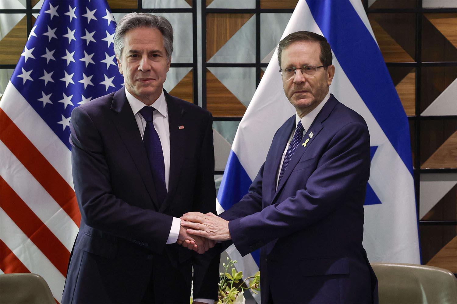 US Secretary of State Antony Blinken (L) meets with Israeli President Isaac Herzog in Tel Aviv
