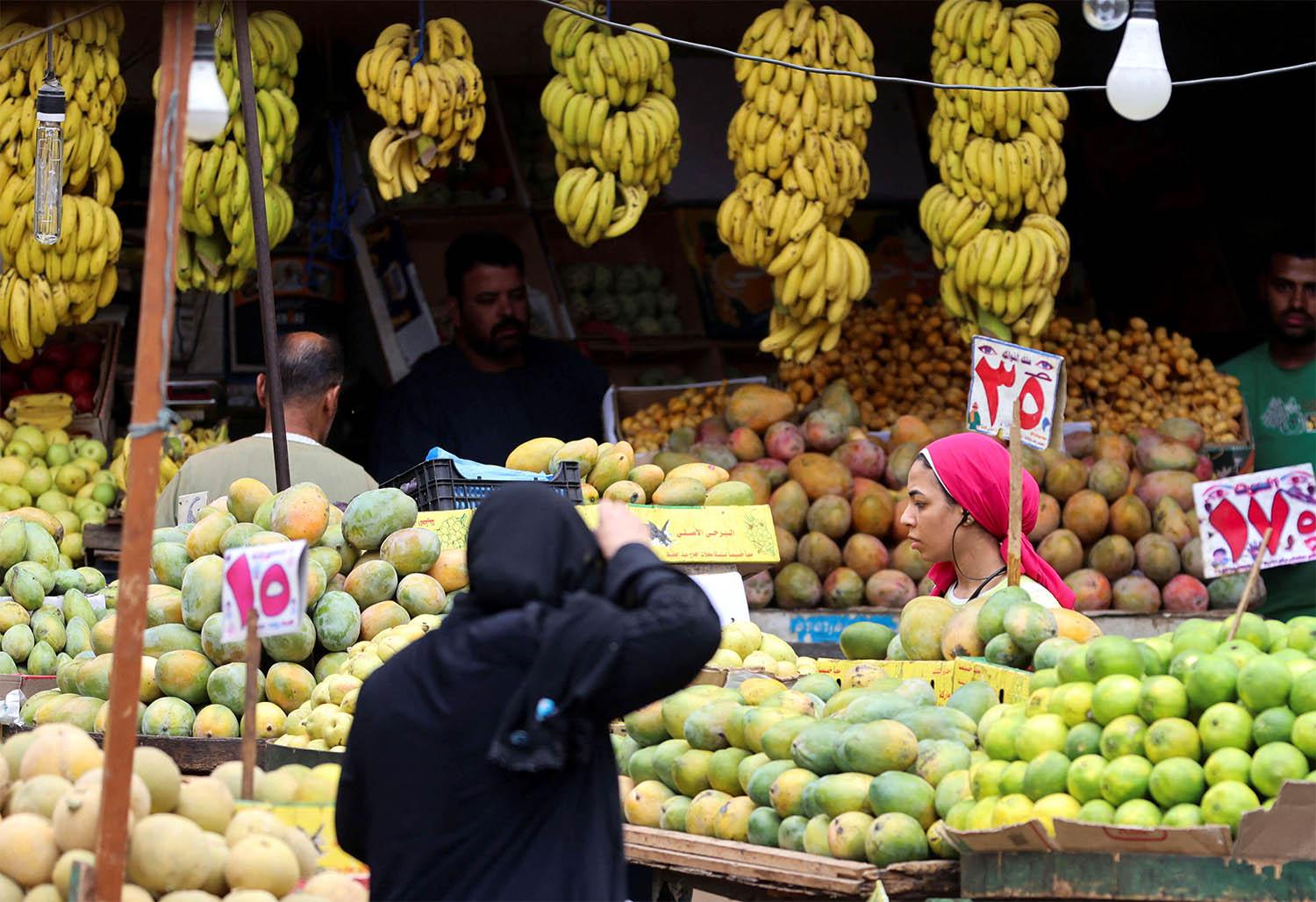 A woman shops at a market in Cairo