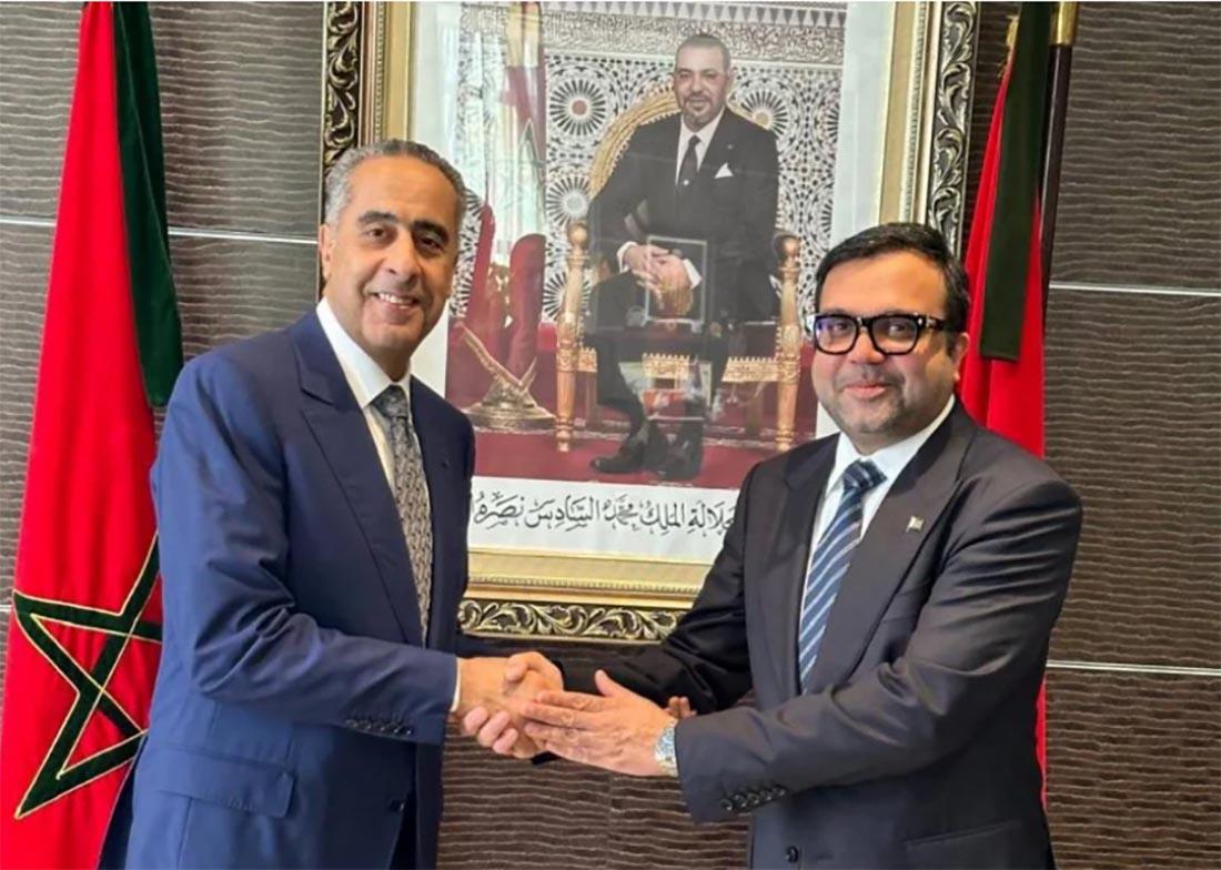 Hammouchi shaking hands with Sami-ur-Rehman